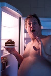 Overweight Man Eating Cake