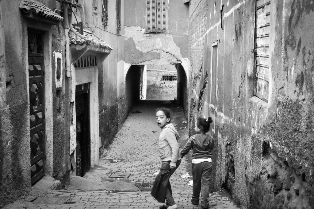 Children run along the walkways of the mellah. The old Jewish quarter is discernible by its narrow, rundown alleys. (photo credit: Michal Shmulovich)