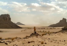 French photographer Loïc Bartolini recounts his transformative March 2025 trek in Algeria’s Sahara, turning desert challenges into soulful art, as featured in GEO magazine.